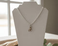 138 - Upcycled White Clover Pendant Necklace with Roller Skate Pendant on Silver Chain