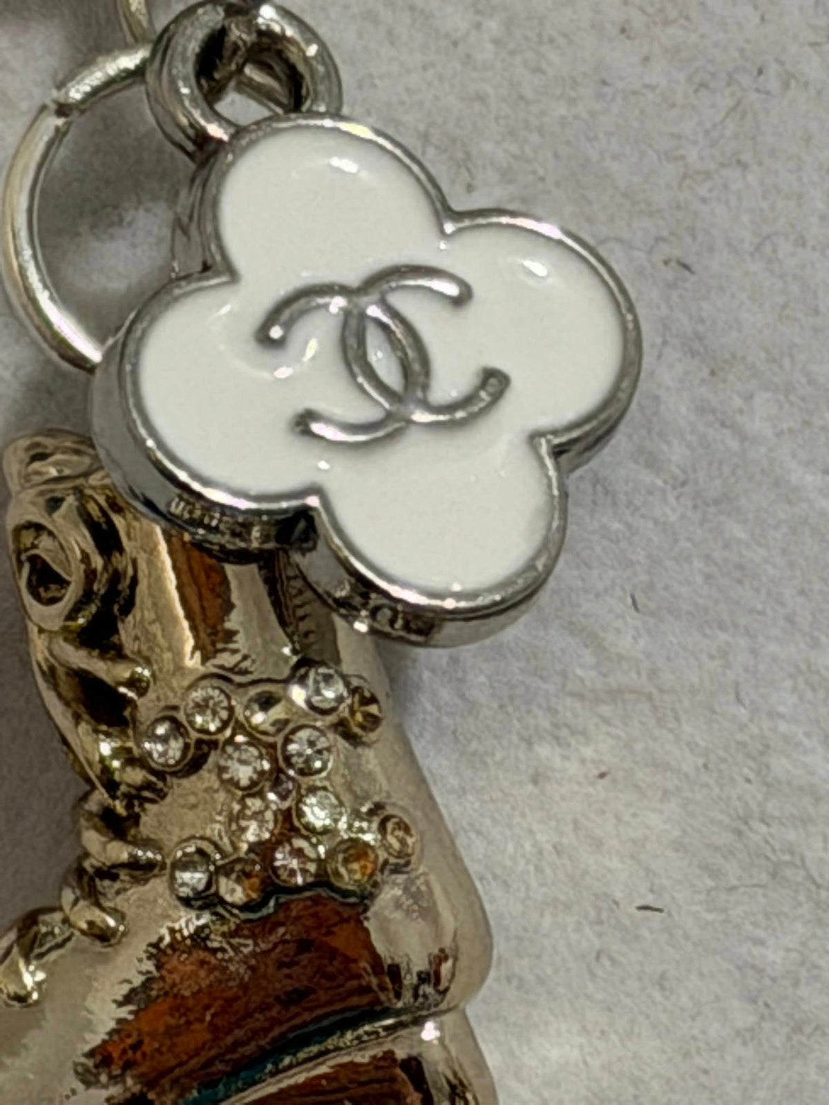 138 - Upcycled White Clover Pendant Necklace with Roller Skate Pendant on Silver Chain