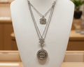 148- Charms with Clear Rhinestones on a Silver Triple Chain Necklace
