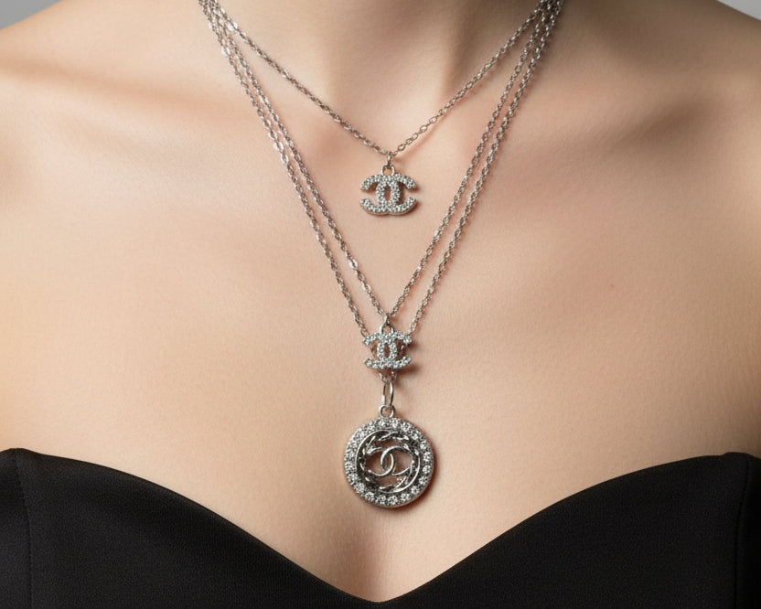 148- Charms with Clear Rhinestones on a Silver Triple Chain Necklace