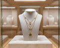 161- Charms on a Gold Triple Chain Necklace