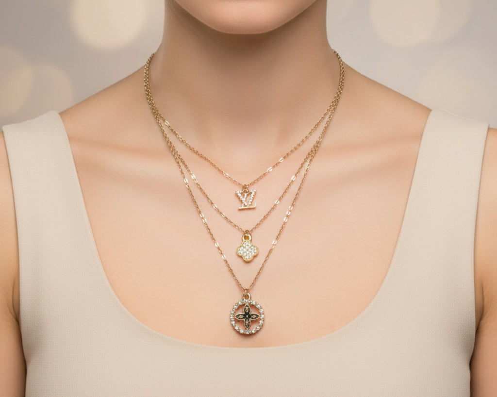 161- Charms on a Gold Triple Chain Necklace