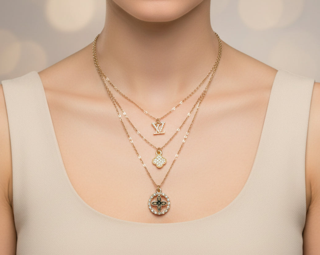 161- Charms on a Gold Triple Chain Necklace