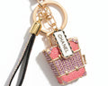 736- Upcycled White and Gold Pendant with Pink Suitcase Charm Bag Charm