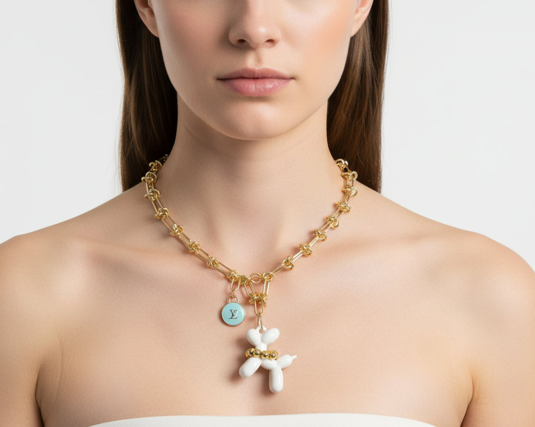 254- Upcycled Gold Necklace with White Balloon Dog and Light Blue charm