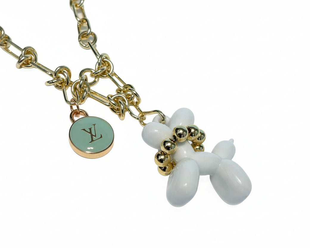 254- Upcycled Gold Necklace with White Balloon Dog and Light Blue charm